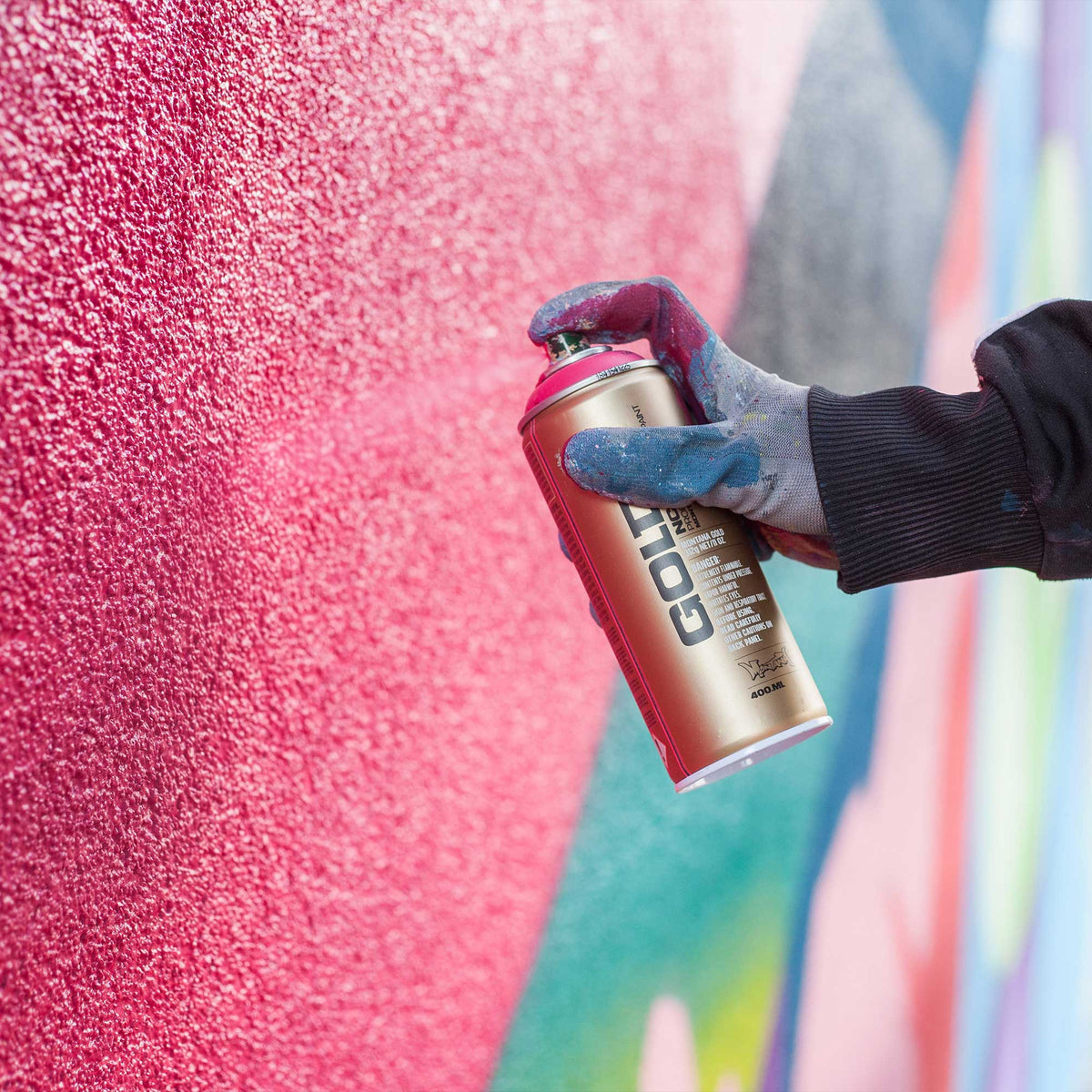 Person spraying with Montana can