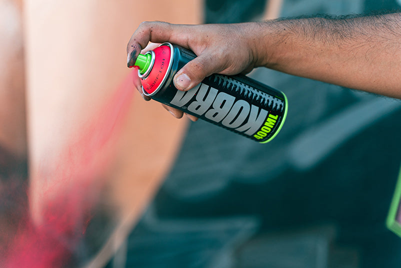 Kobra high pressure can in red being sprayed 