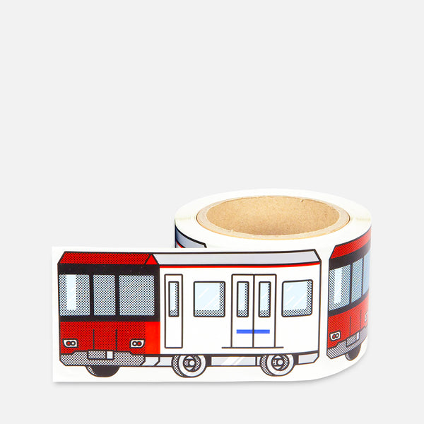 Roll of stickers with a white red train Barcelona Metro design on a grey background