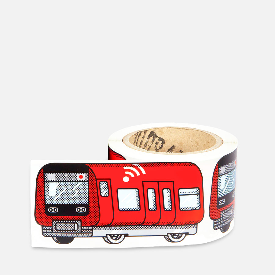 Roll of stickers with a red train Copenhagen-S-Train design on a grey background