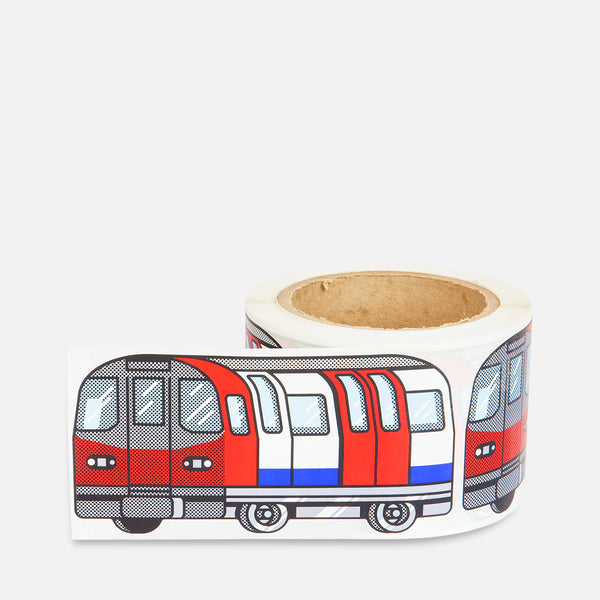 Roll of stickers with a blue red white train London Subway design on a grey background