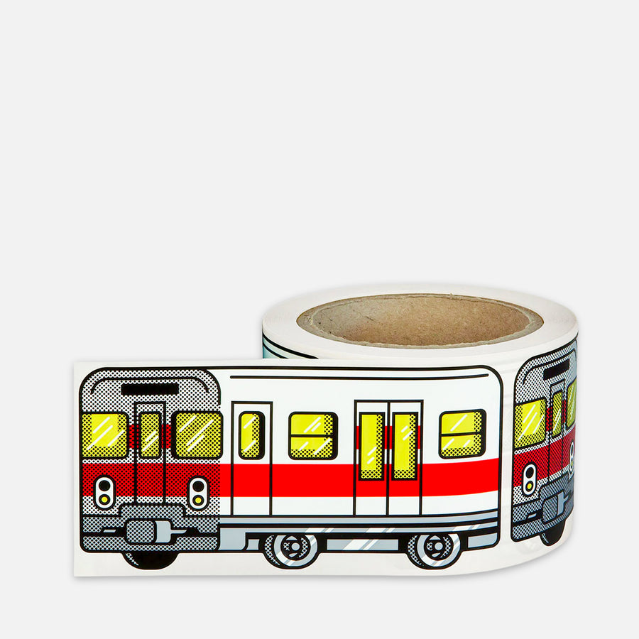 Roll of stickers with a red white yellow train Milan Metro design on a grey background