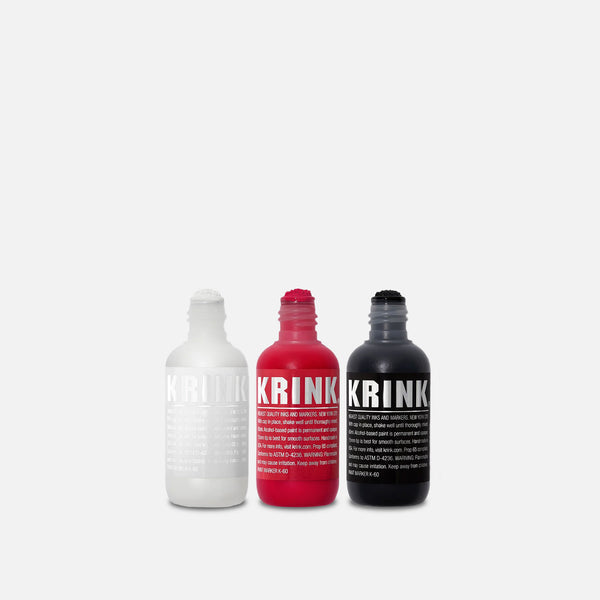 Krink K-60 Box of Black/White/Red Paint Markers on grey background.