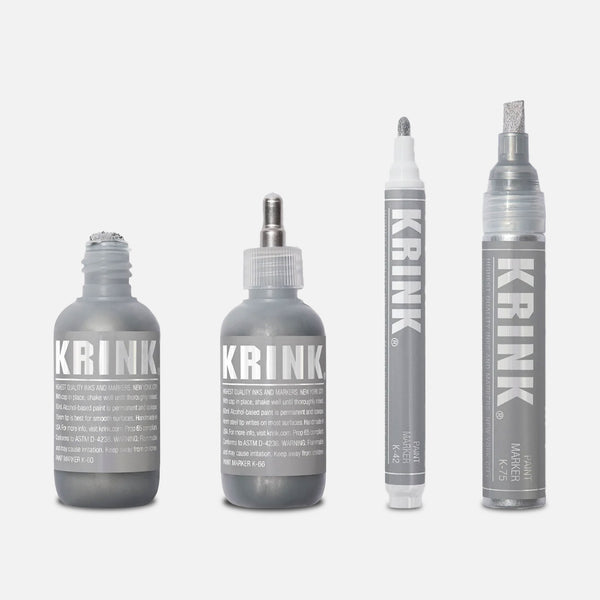 Krink Super Silver set on a grey background.