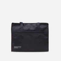 The Montana Nylon Can Bag 3rd Generation on a grey background