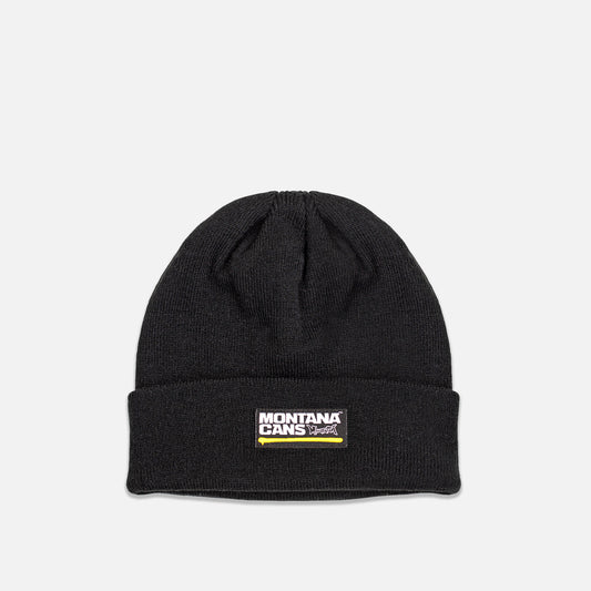 Black beanie with Montana Cans logo on a light gray background