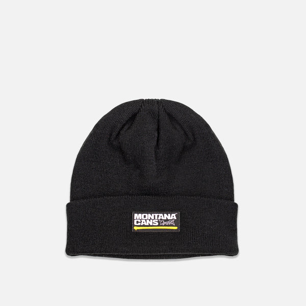 Black beanie with Montana Cans logo on a light gray background