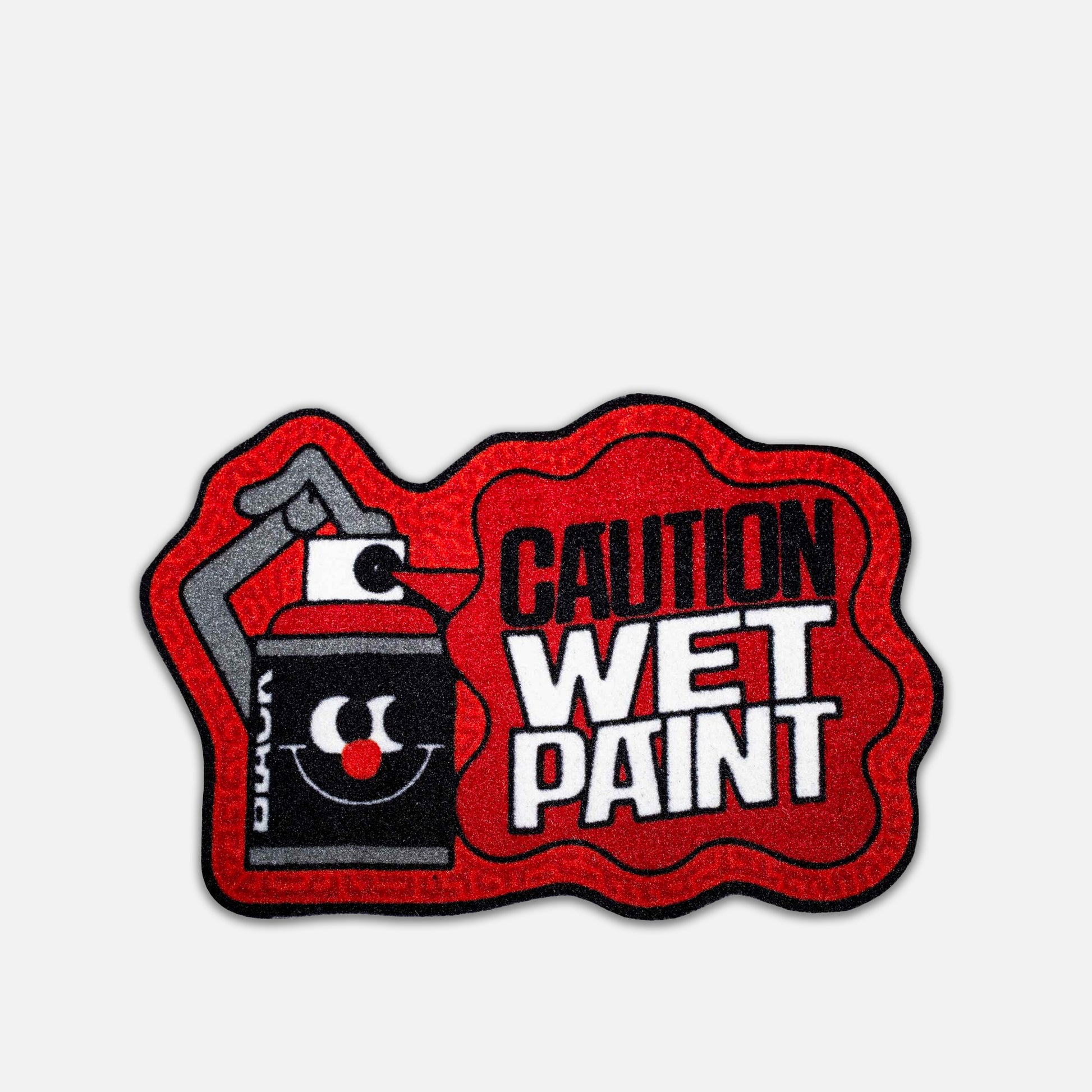 Caution wet paint sign with red border and black spray can icon on a grey background