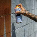 A can of MTN 94 being sprayed on a wall.
