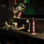 Two MTN Vice spray paint cans with one being sprayed on metal.